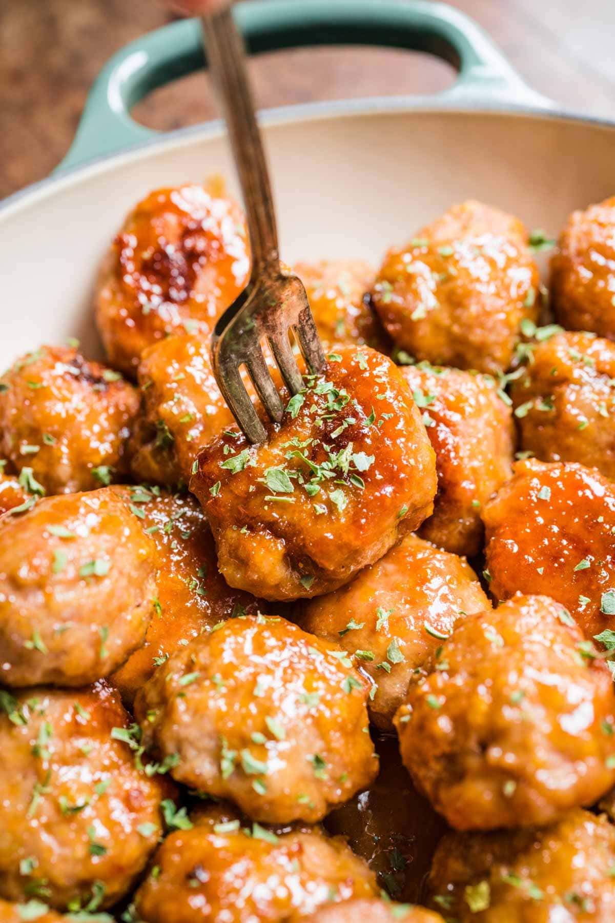 Ham Balls with Brown Sugar Glaze meatballs on serving dish with fork