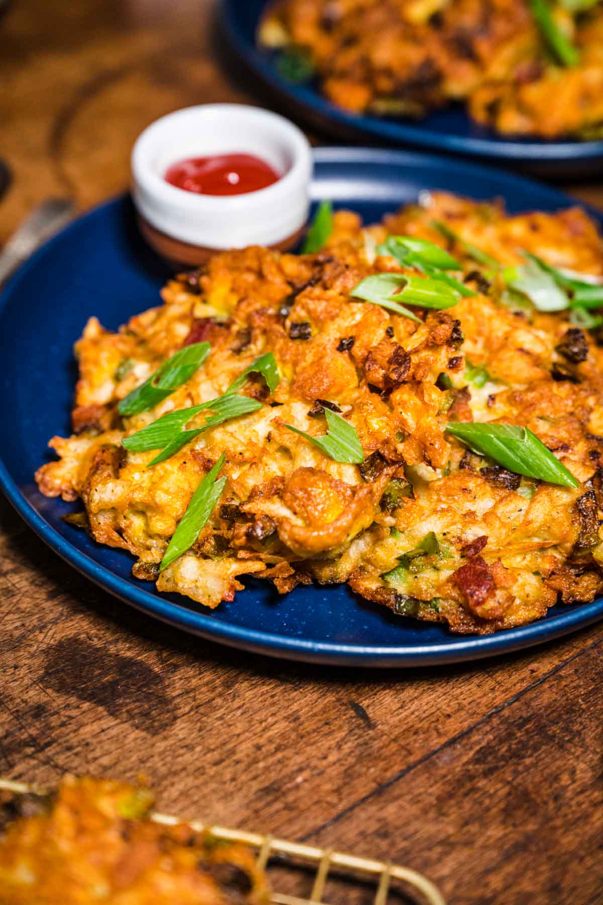 Loaded Breakfast Potato Pancakes on plate with ketchup