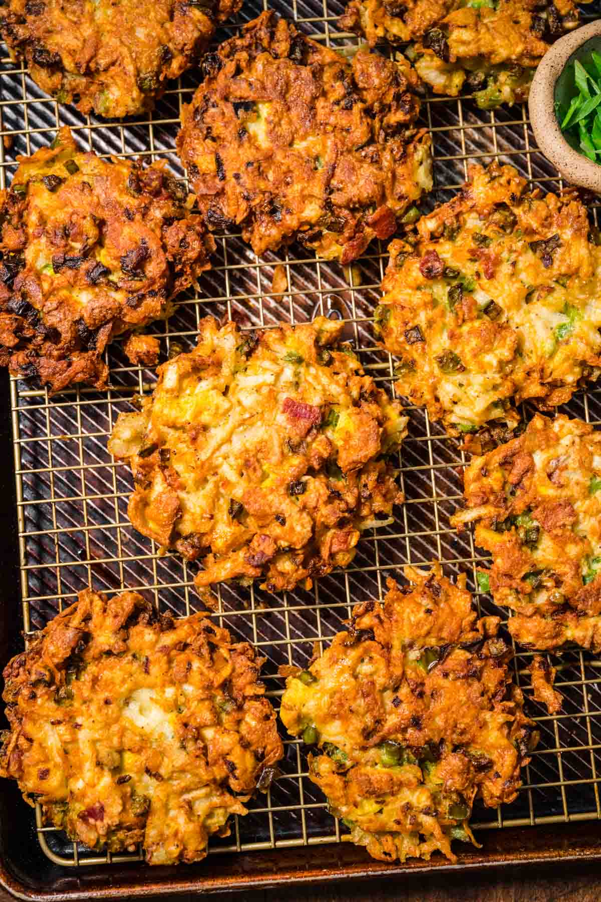 Loaded Breakfast Potato Pancakes after frying on wire rack