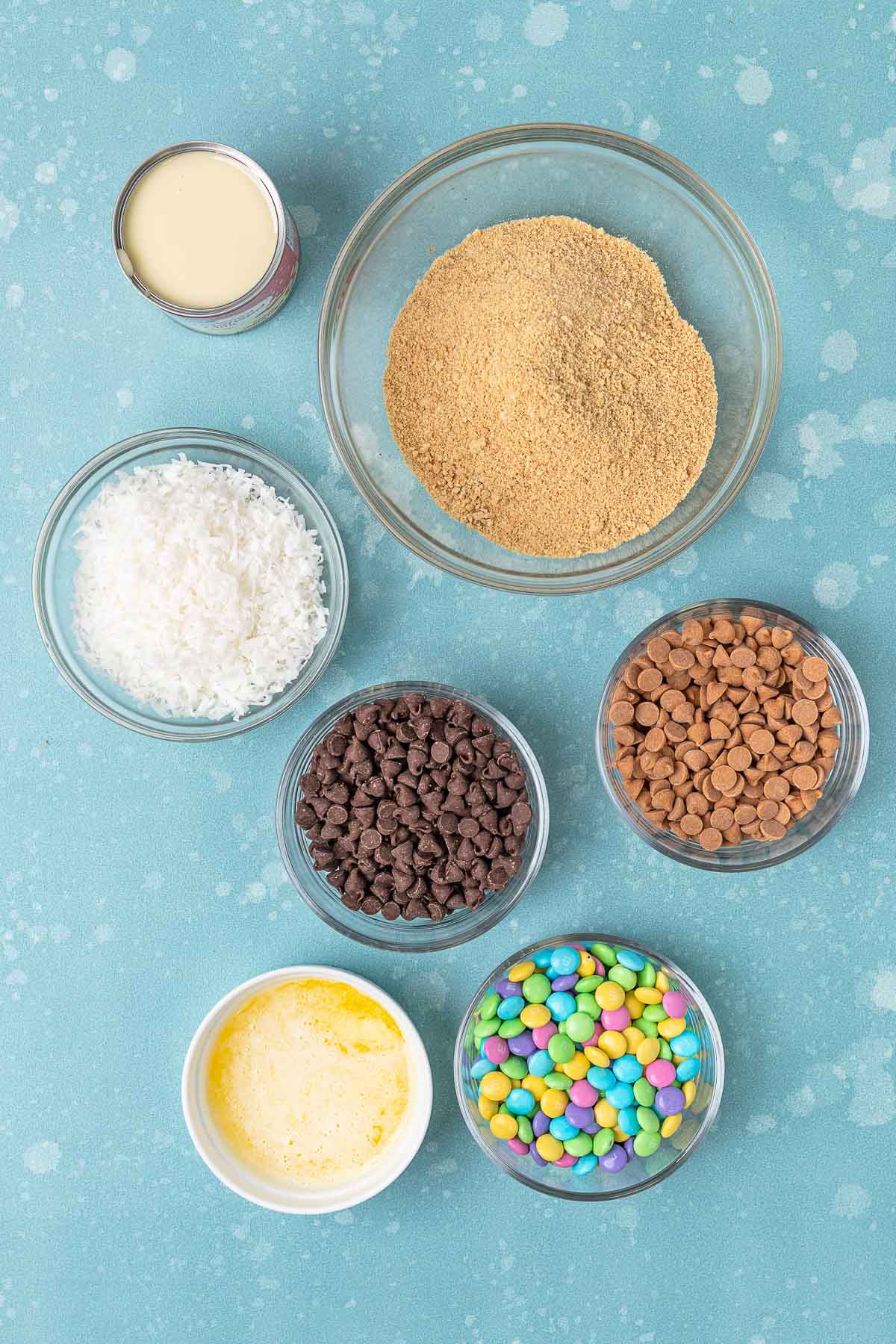 portioned ingredients for Magic Easter Layer Bars in little bowls