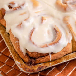 Maple Cinnamon Rolls with icing in baking dish