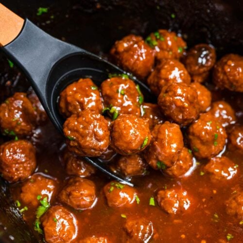 Marmalade Meatballs in sauce in crock pot with spoon