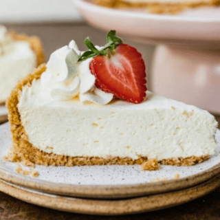 Side view of cheesecake slice with strawberry
