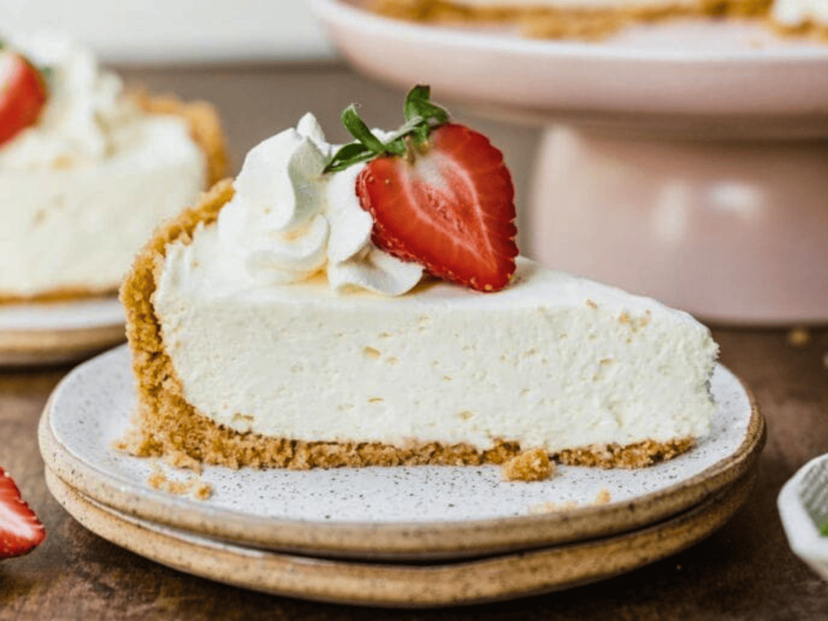 Side view of cheesecake slice with strawberry