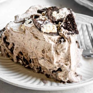 Oreo Ice Cream Pie slice on plate with fork