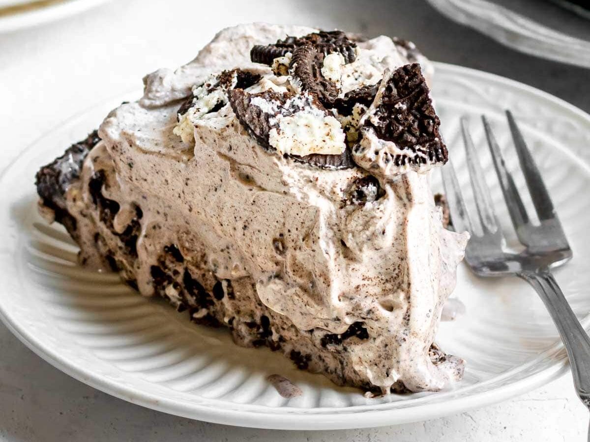 Oreo Ice Cream Pie slice on plate with fork