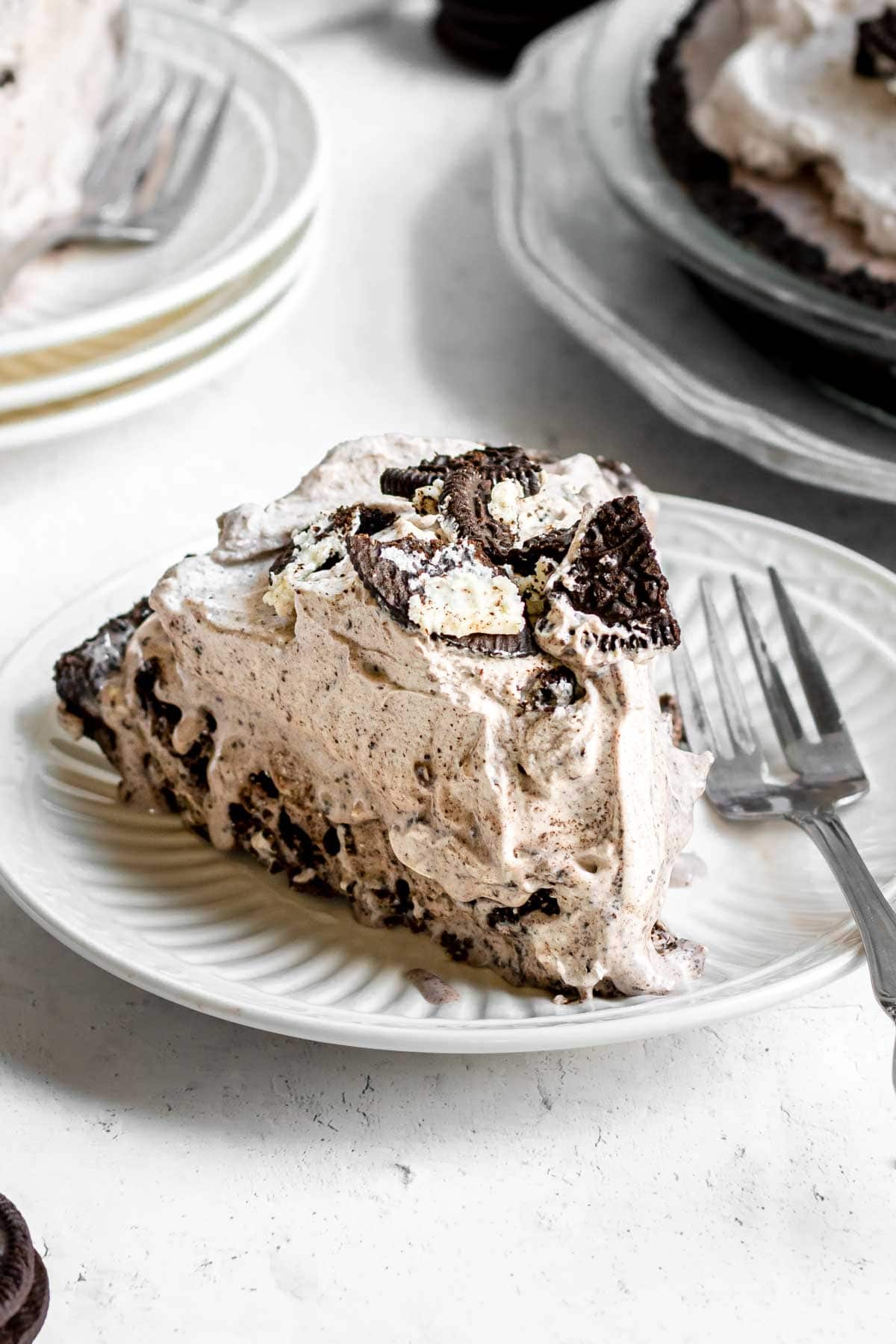 Oreo Ice Cream Pie slice on plate with fork
