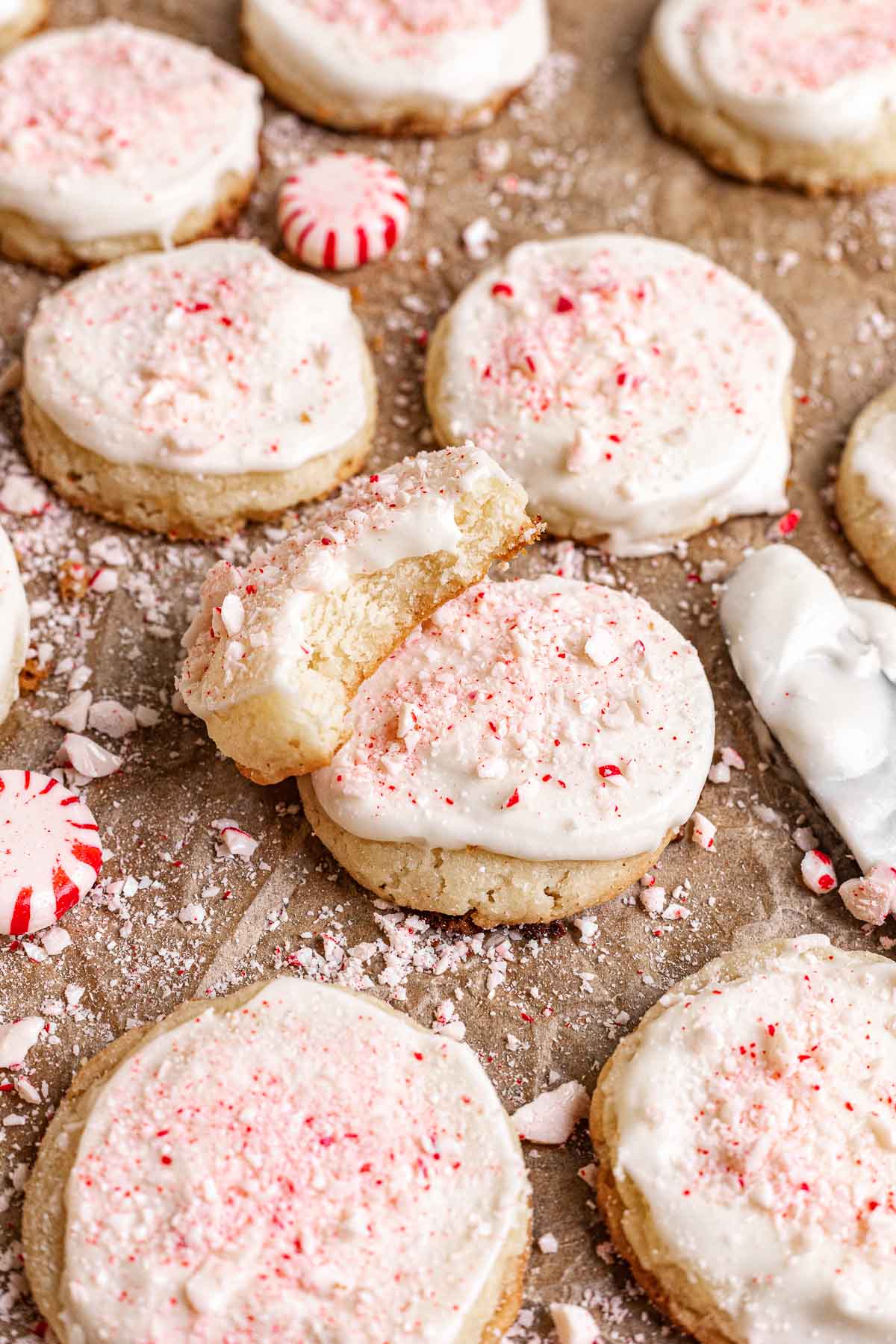 Peppermint Meltaway cookies spread out on parchment paper.