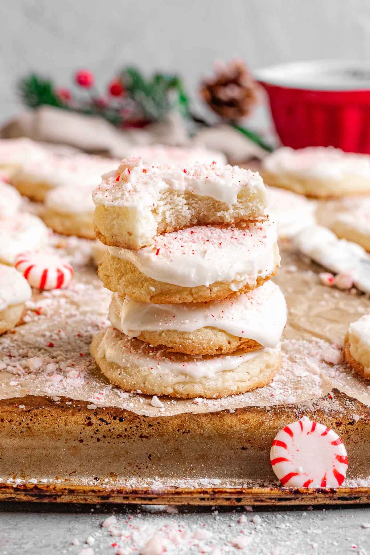 Peppermint Meltaway cookies stacked on a festive holiday table.