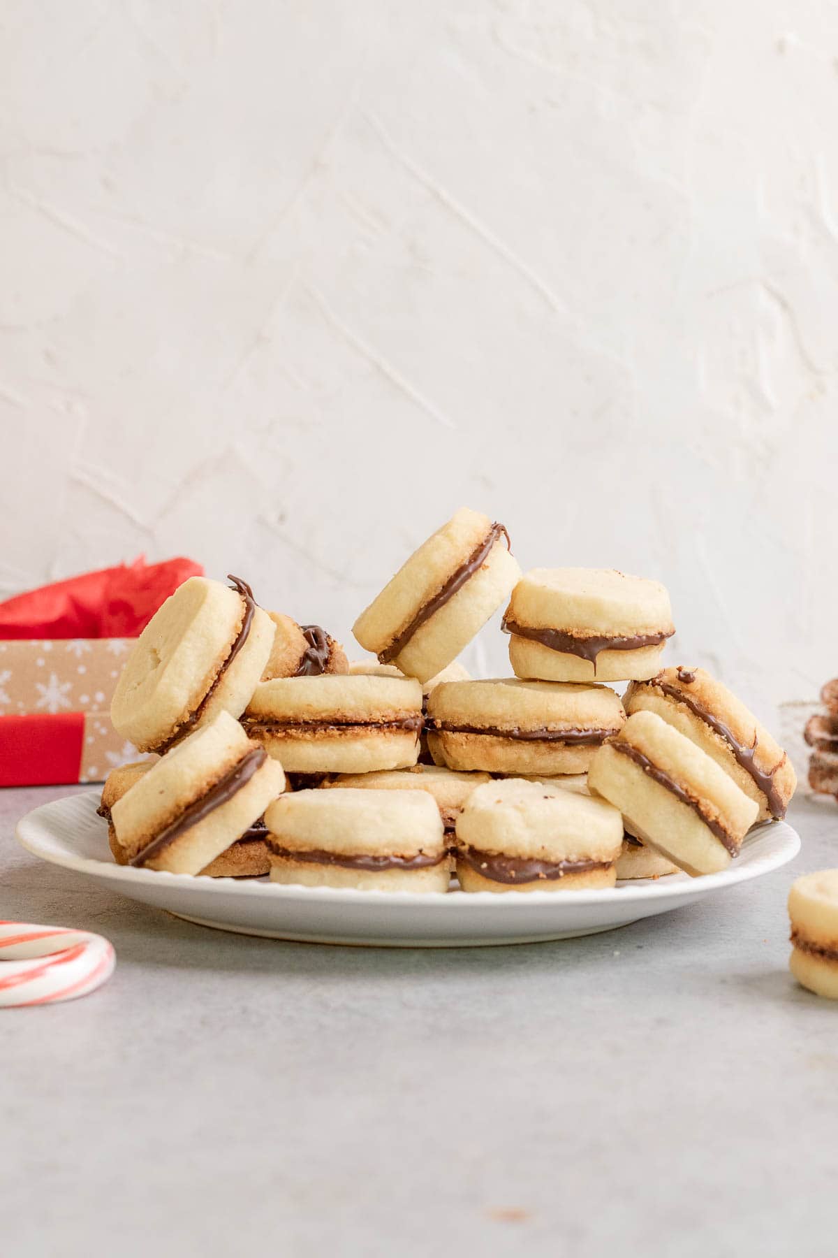 Peppermint Sandwich Cookies baked and filled in pile on plate