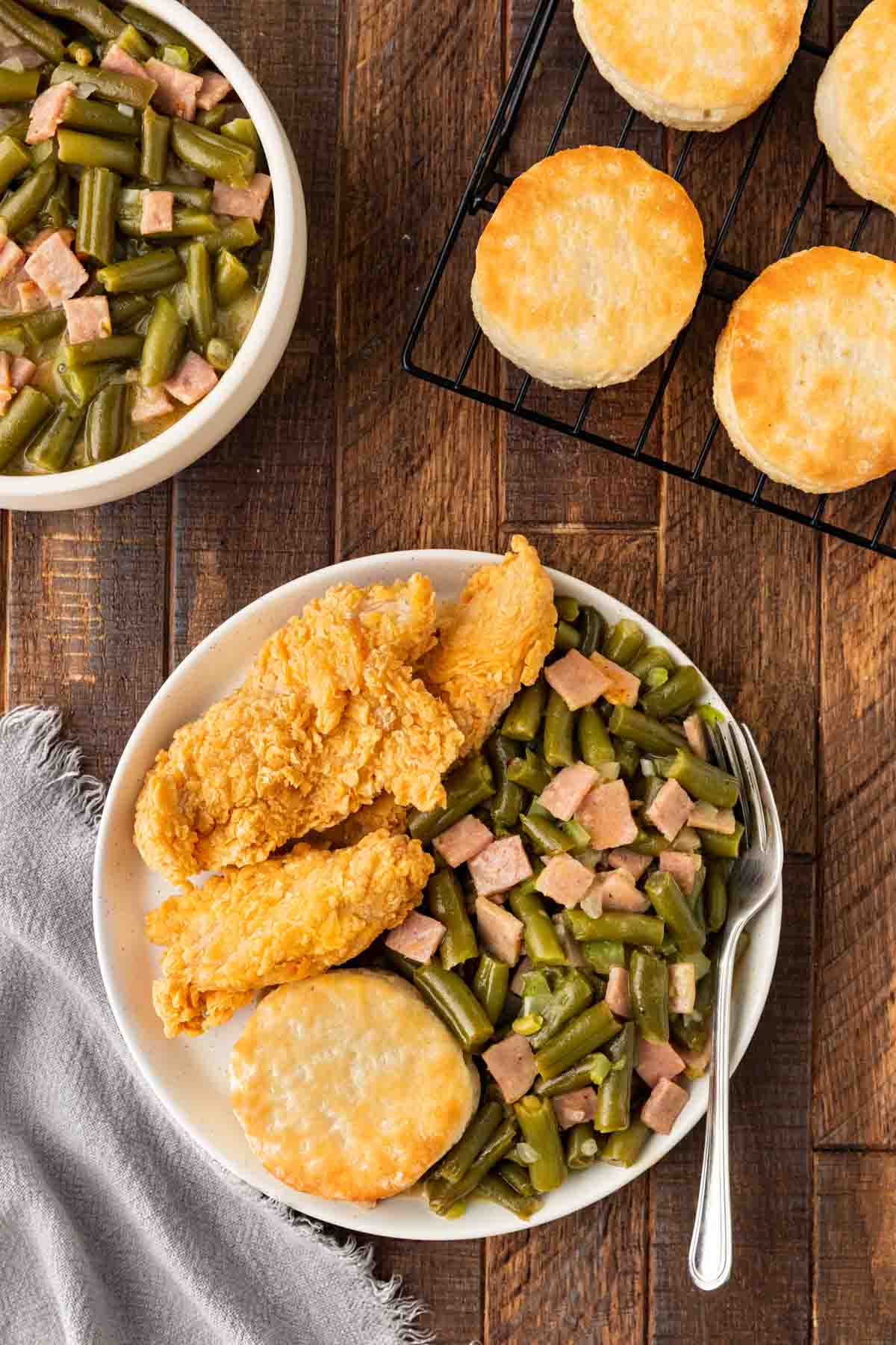 Popeye's Green Beans on plate with fried chicken and biscuit