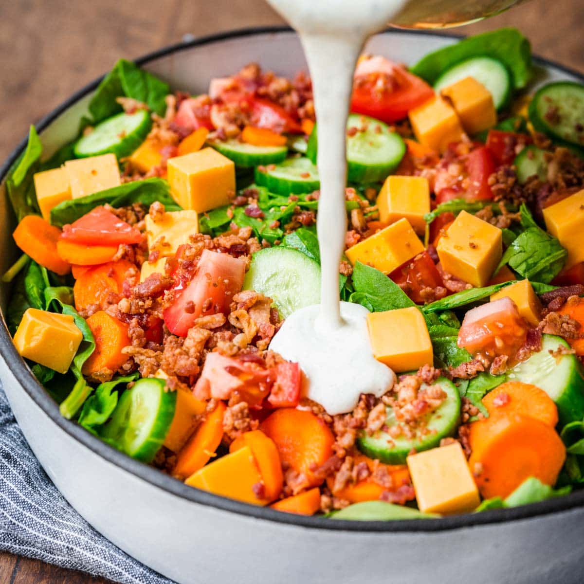 Dry Buttermilk Ranch Mix poured as dressing over garden salad