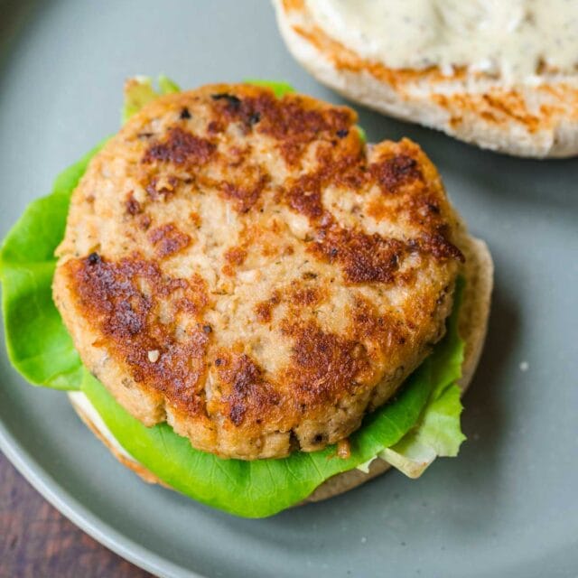 Salmon Burgers on serving plate showing patty