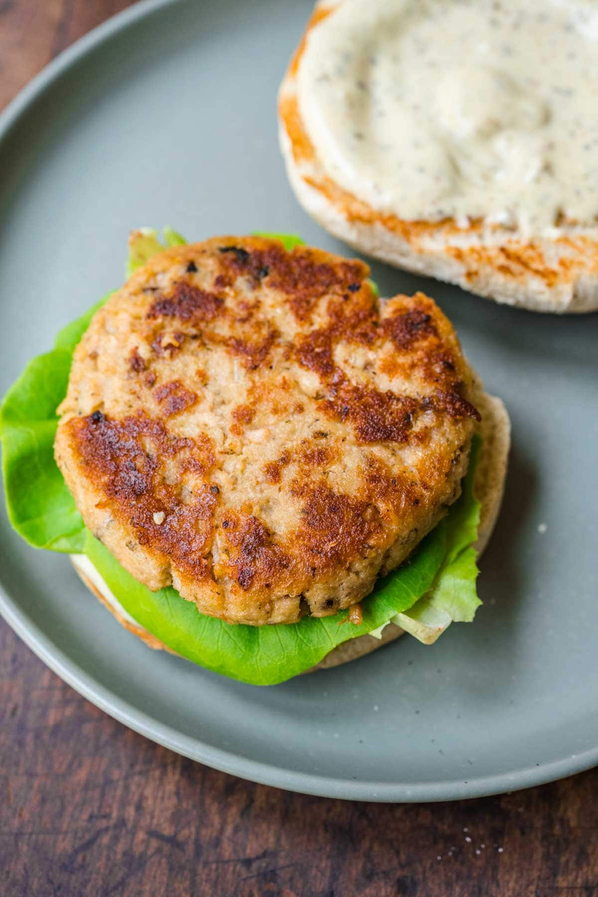 Salmon Burgers on serving plate showing patty