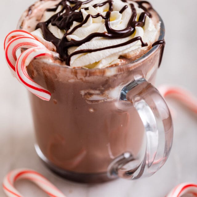Slow Cooker Peppermint Hot Chocolate in Mug with Whipped Cream and Chocolate Sauce