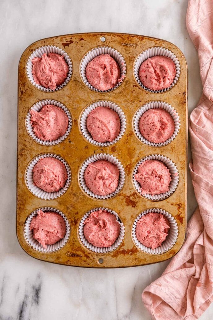 Strawberry Cupcakes batter in muffin pan unbaked
