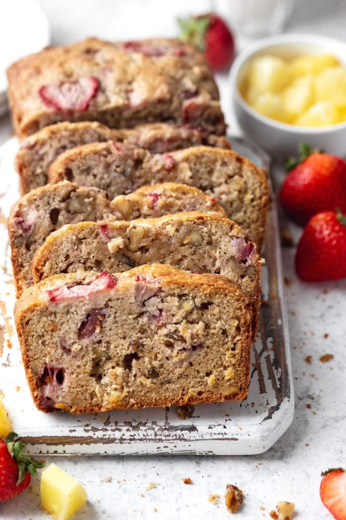 Strawberry Pineapple Bread sliced on serving platter