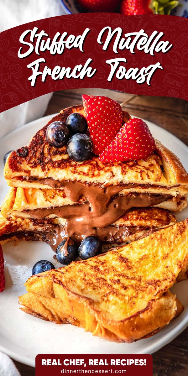 Stack of french toast sliced in half featuring the nutella filling. Blueberries and strawberries for garnish served on a white plate.
