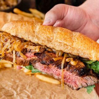 hand holding assembled sandwich