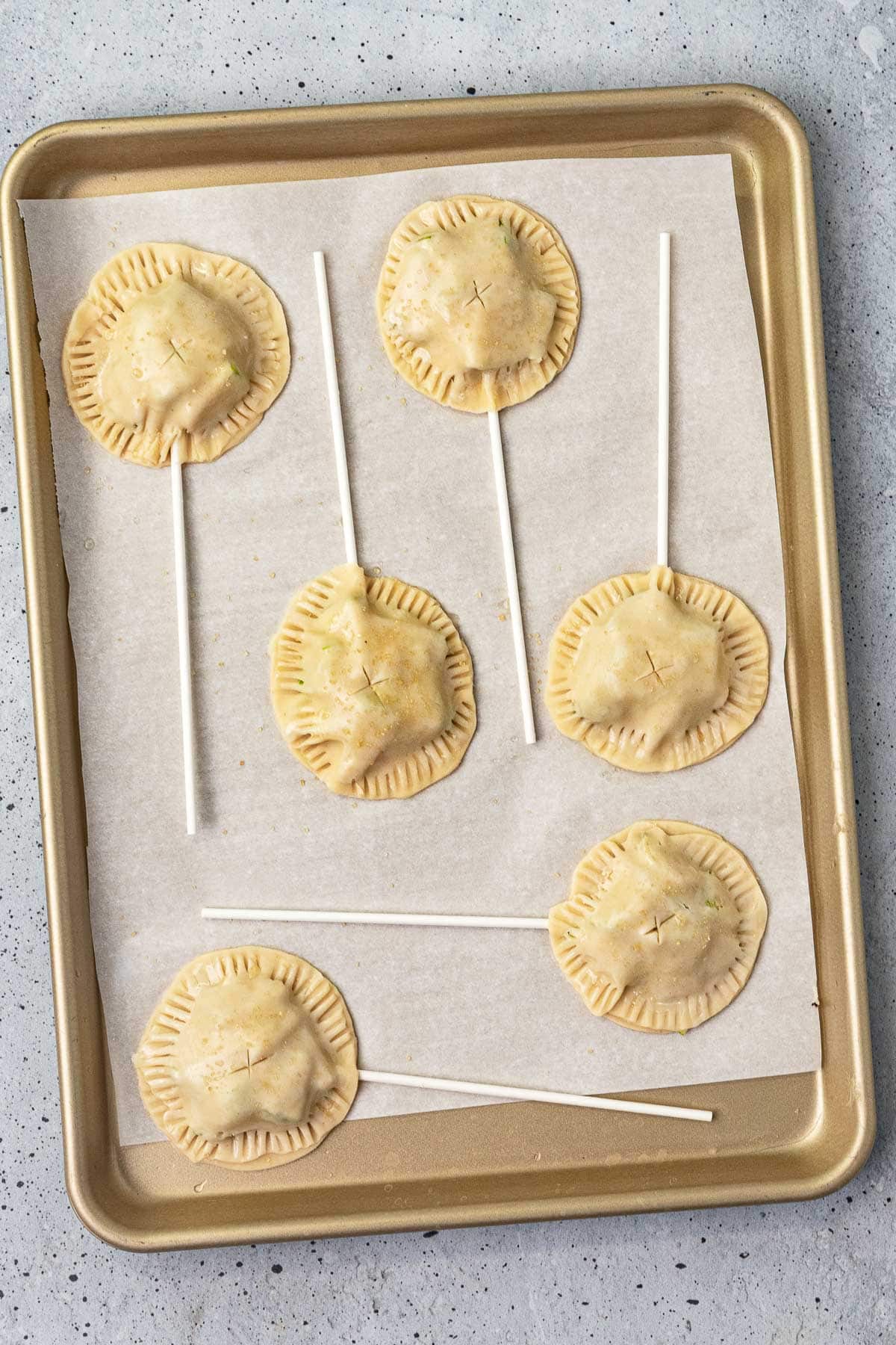 Apple Pie Pops on baking pan before baking