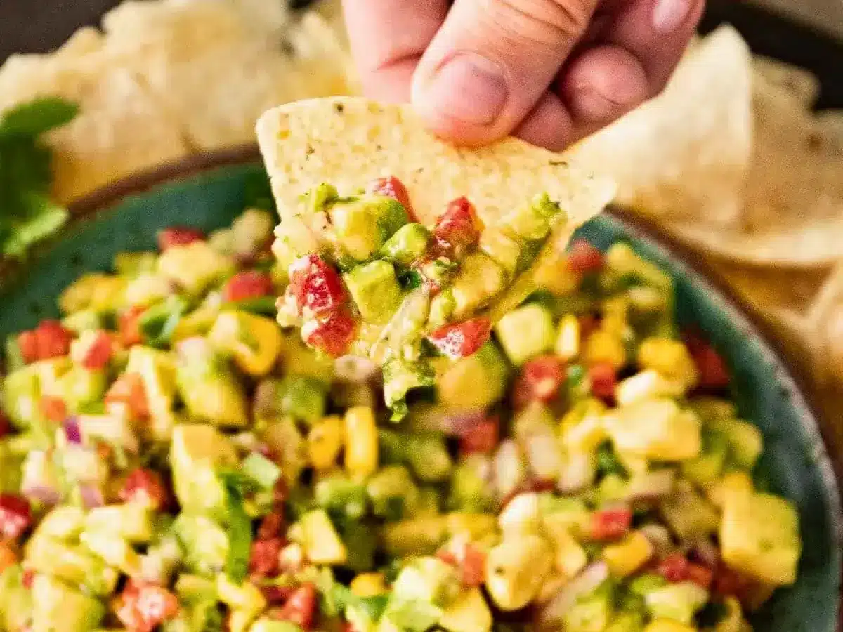 Chip scooping up salsa