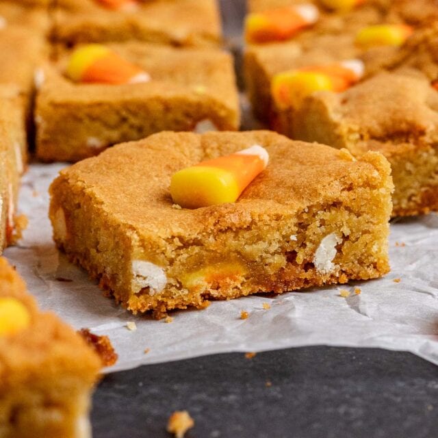 Candy Corn Blondies cut in squares on parchment paper