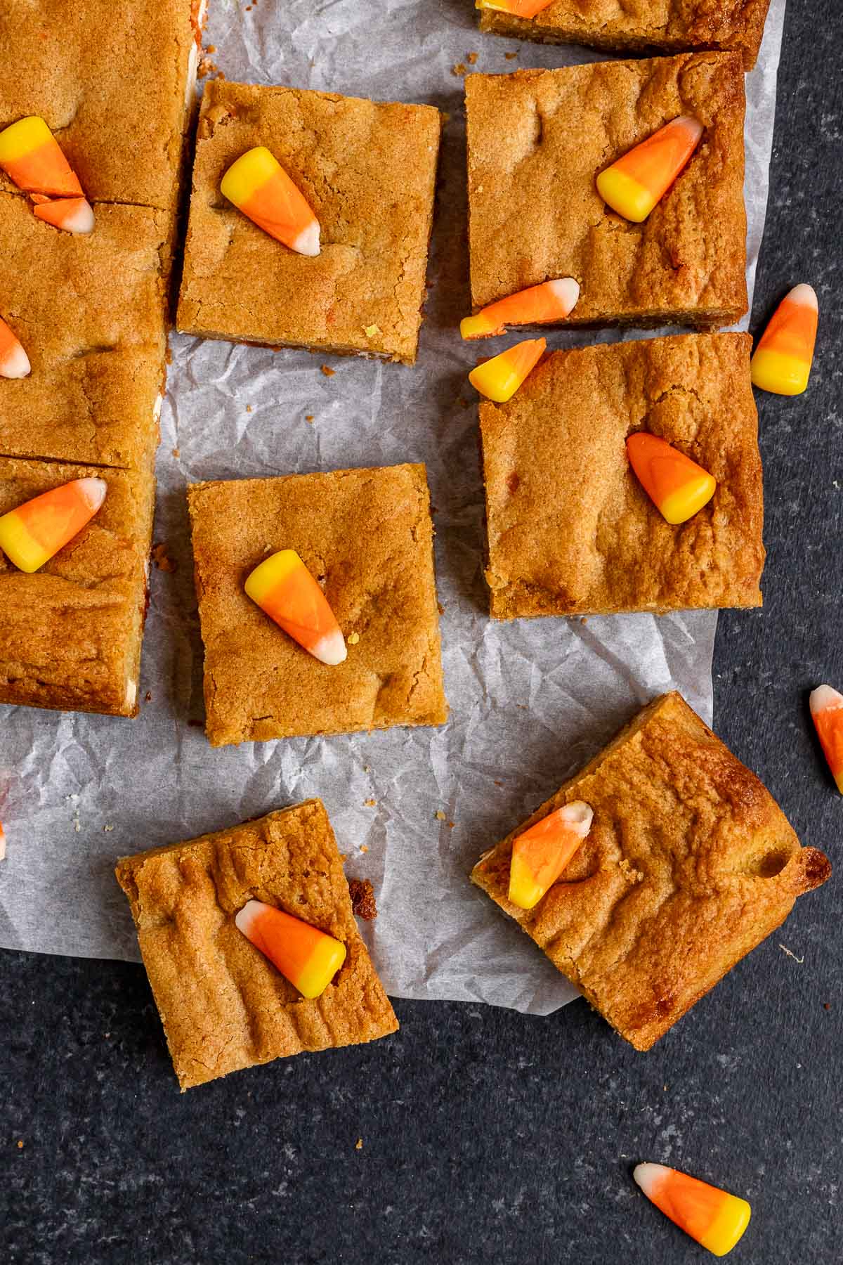 Candy Corn Blondies cut in squares on parchment paper top view