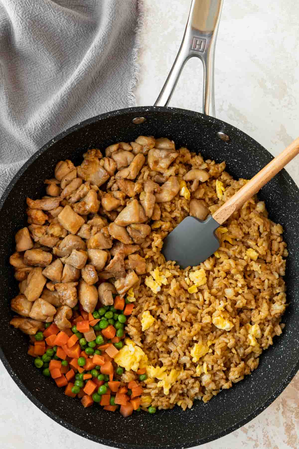 Chicken Fried Rice egg rice mixture with chicken and veggies in skillet before mixing