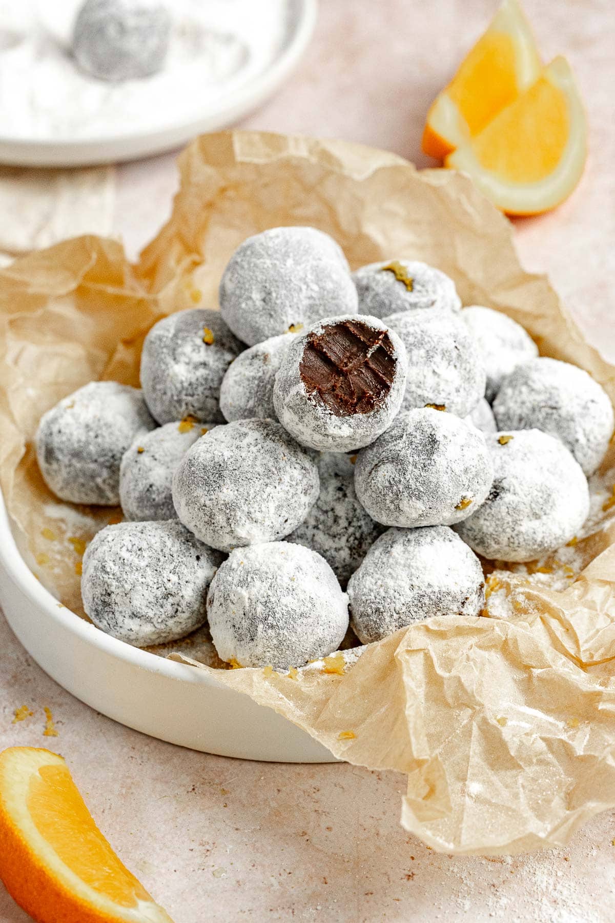 Chocolate Orange Truffles in serving bowl with bite taken