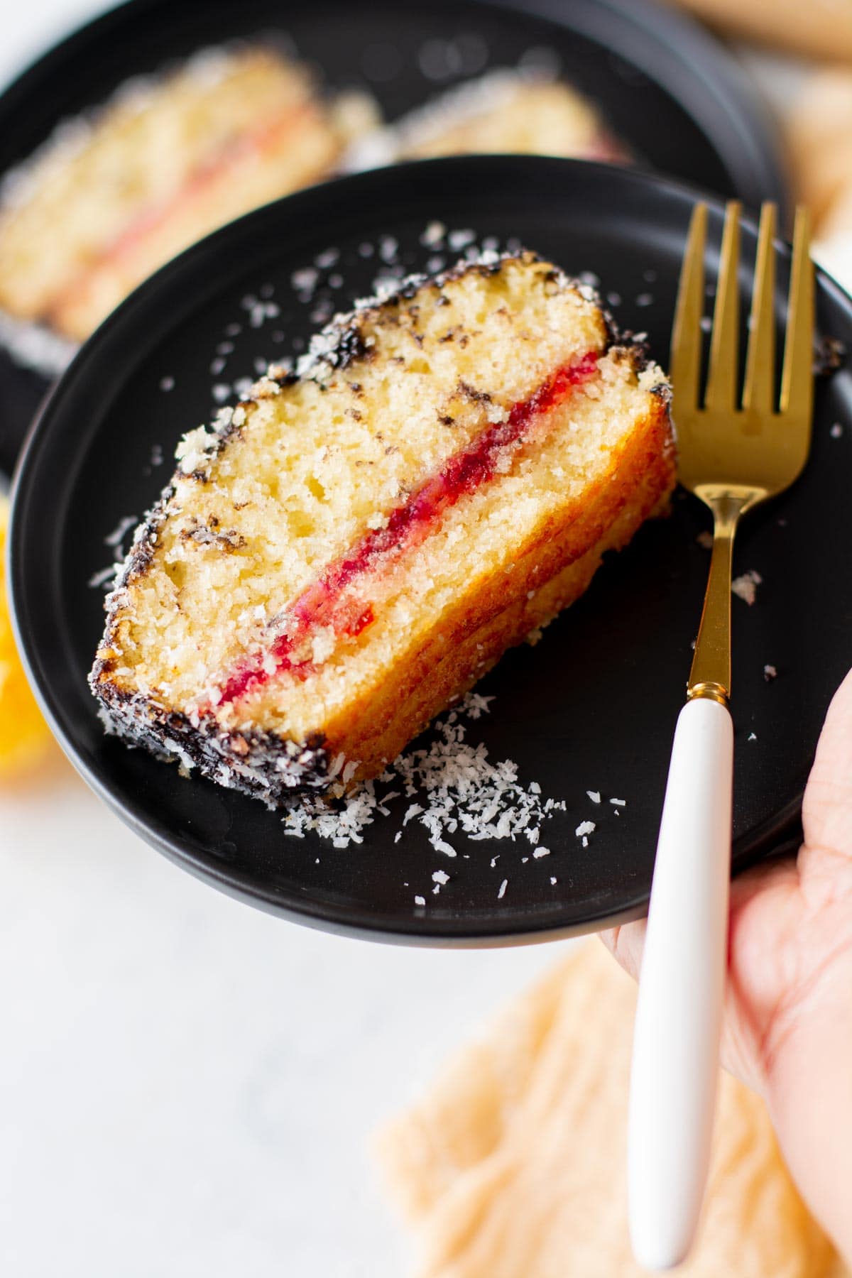 Lamington Loaf Cake slice on a plate