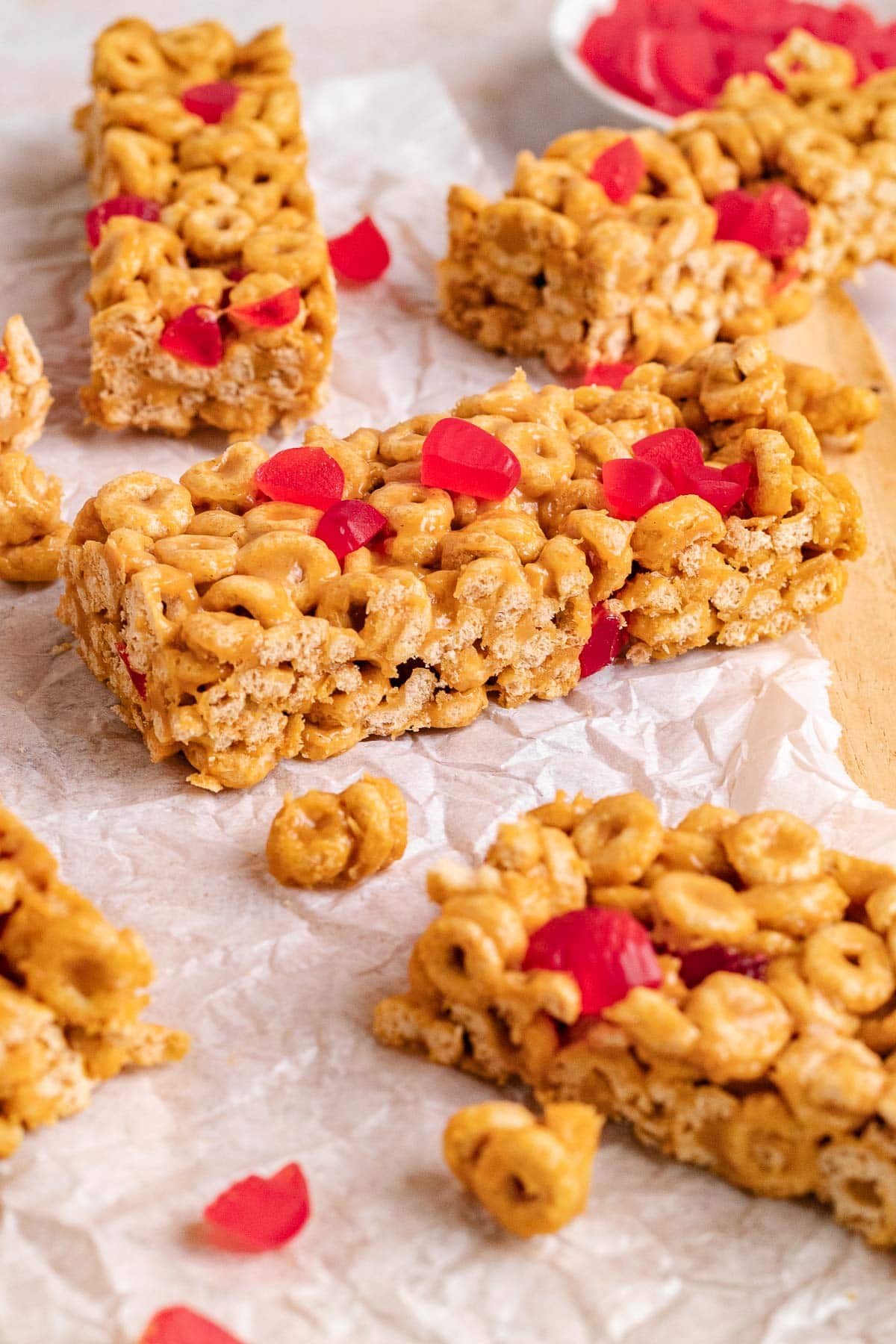 Peanut Butter and Jelly Cereal Bars on cutting board 4x3