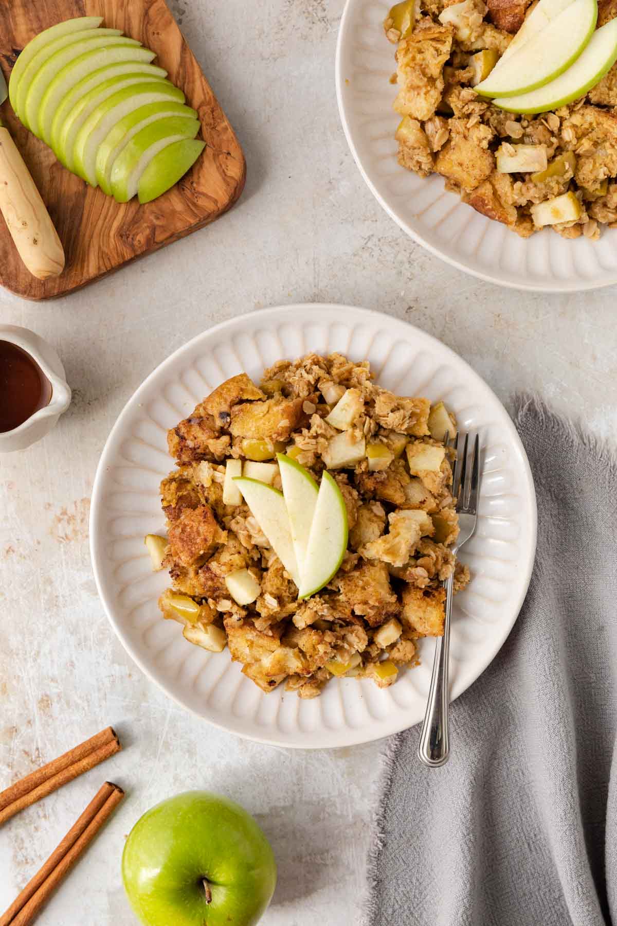 Apple Crisp French Toast Bake serving on a plate with apple slices on top