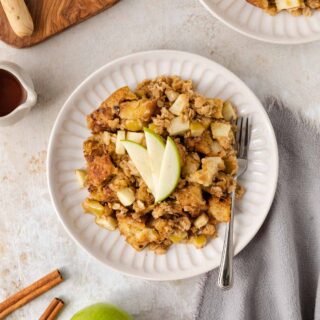 Apple Crisp French Toast Bake serving on a plate with apple slices on top