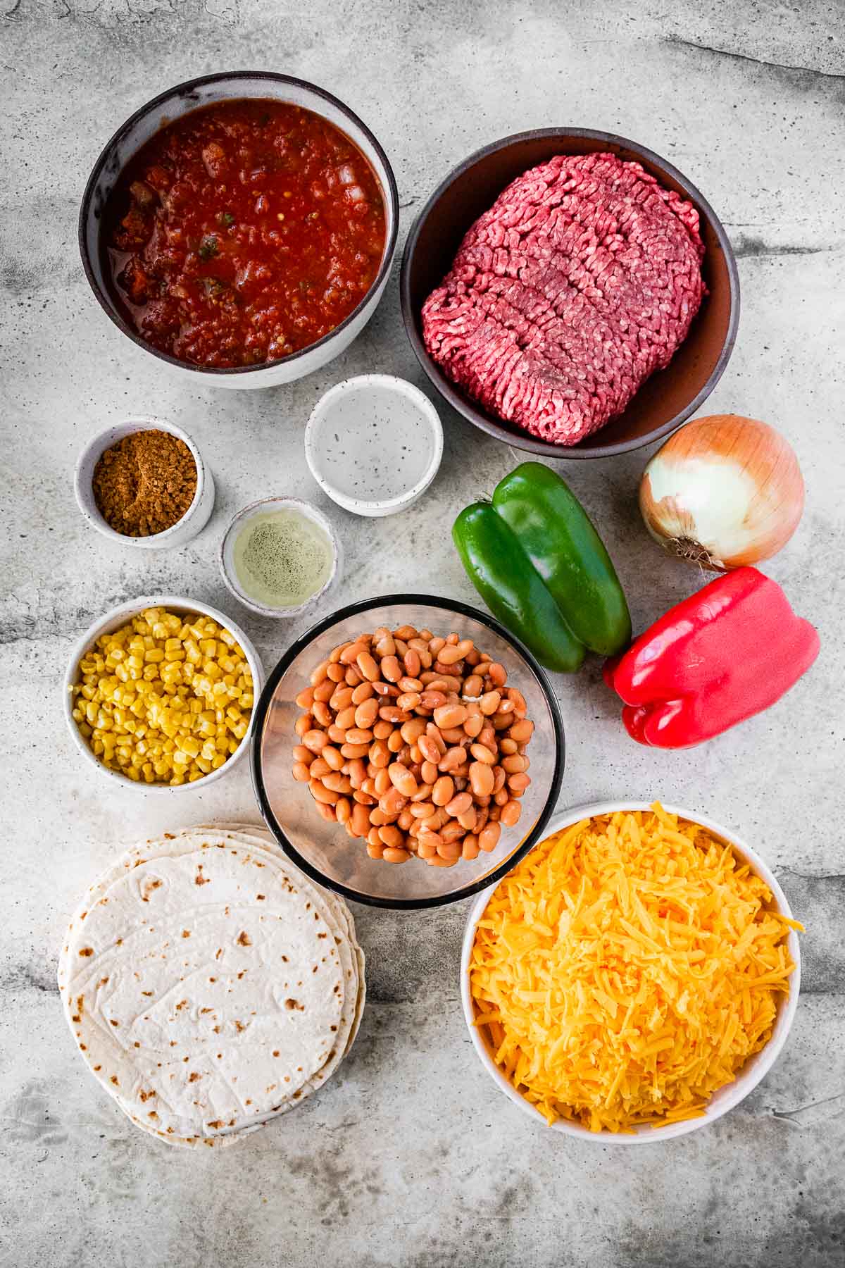 Cheesy Taco Lasagna ingredients in separate bowls