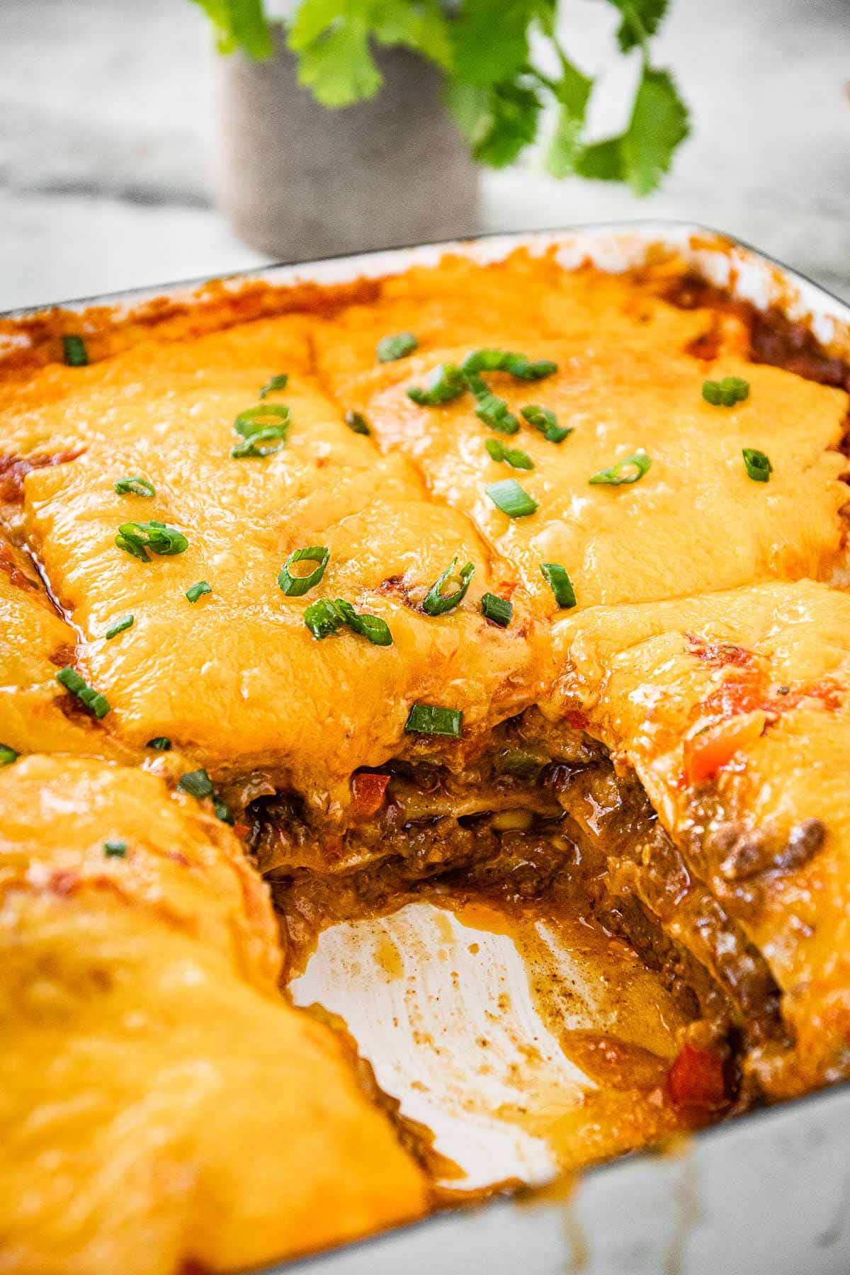 Cheesy Taco Lasagna baked with slice removed