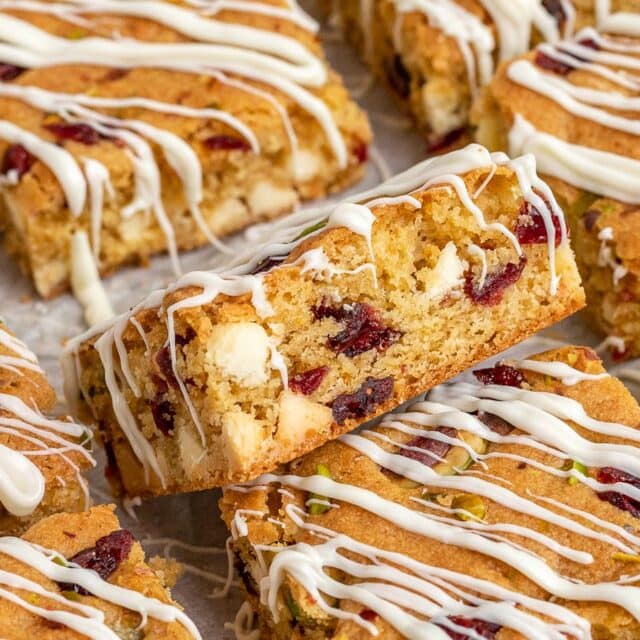 bars with white chocolate drizzle sliced on parchment
