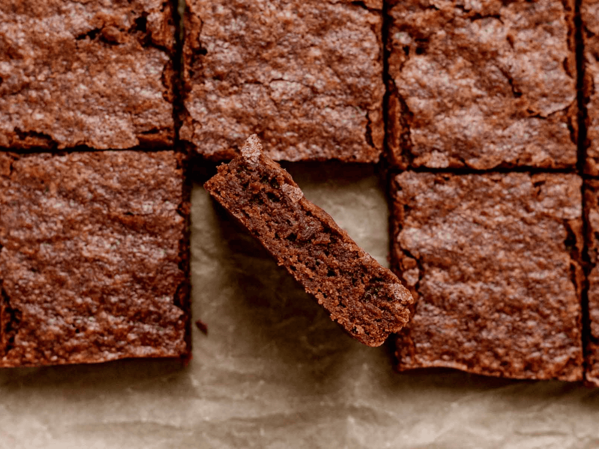 chocolate chewy dessert on a baking sheet cut into squares