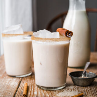 Classic Horchata in glass with cinnamon rim and carafe
