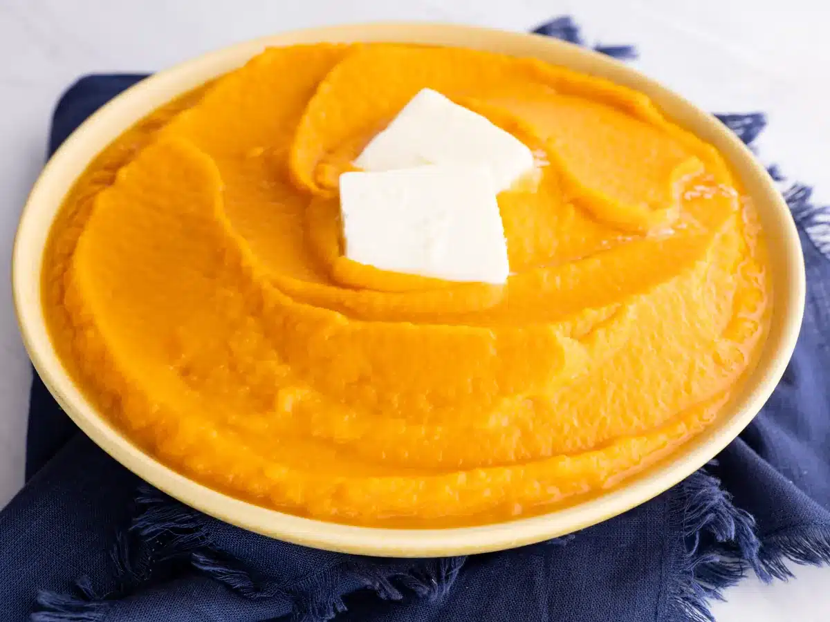 Cooked vegetable in a bowl with a butter garnishment