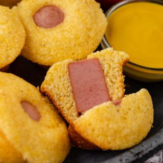 Corndog Mini Muffins with dipping sauces and one sliced in half