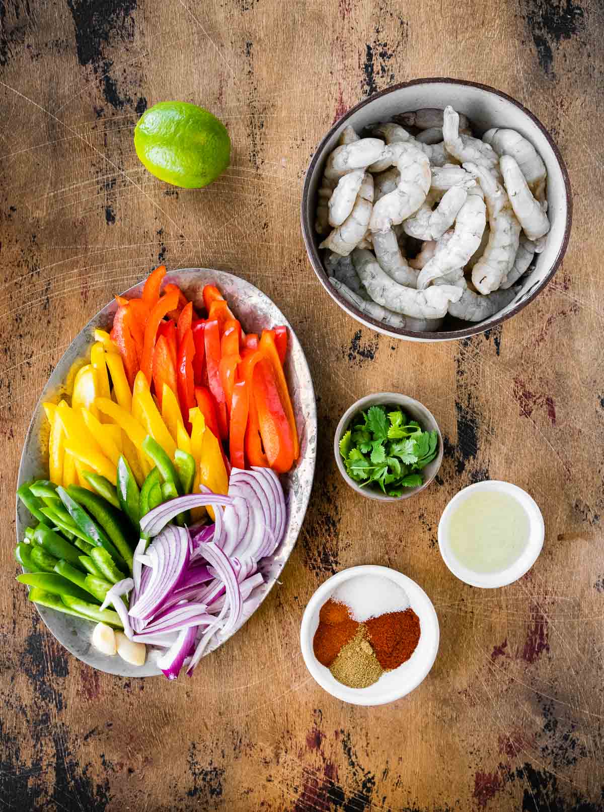 Shrimp Fajitas ingredients laid out in prep bowls
