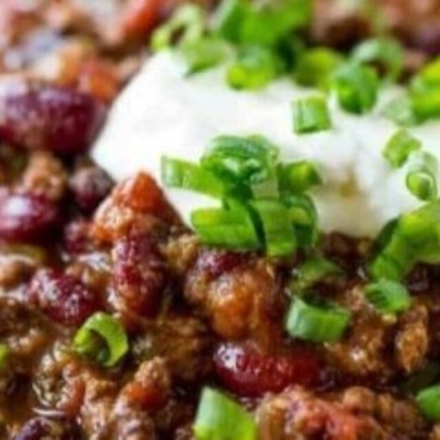 Beef and bean chili topped with sour cream and chives.