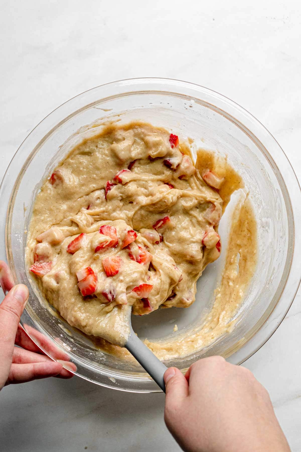 Strawberry Crumb Muffins batter in bowl with spoon