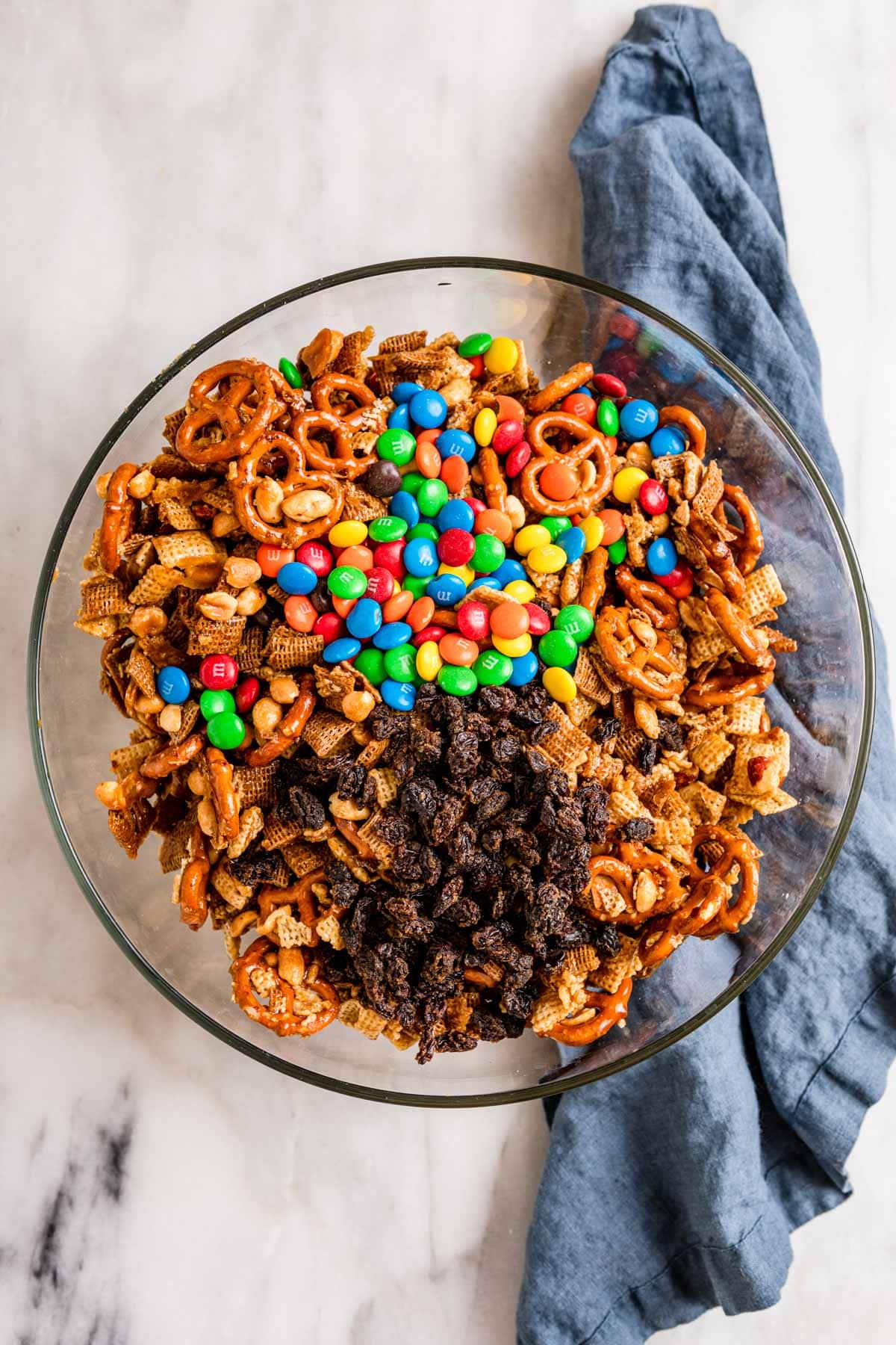 Sweet and Salty Snack Mix with all ingredients in mixing bowl