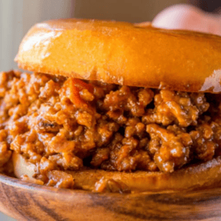 sloppy Joe sandwich on wood plate