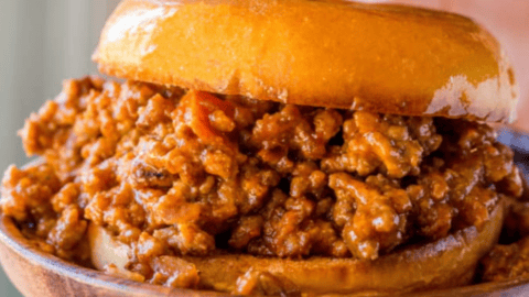 sloppy Joe sandwich on wood plate
