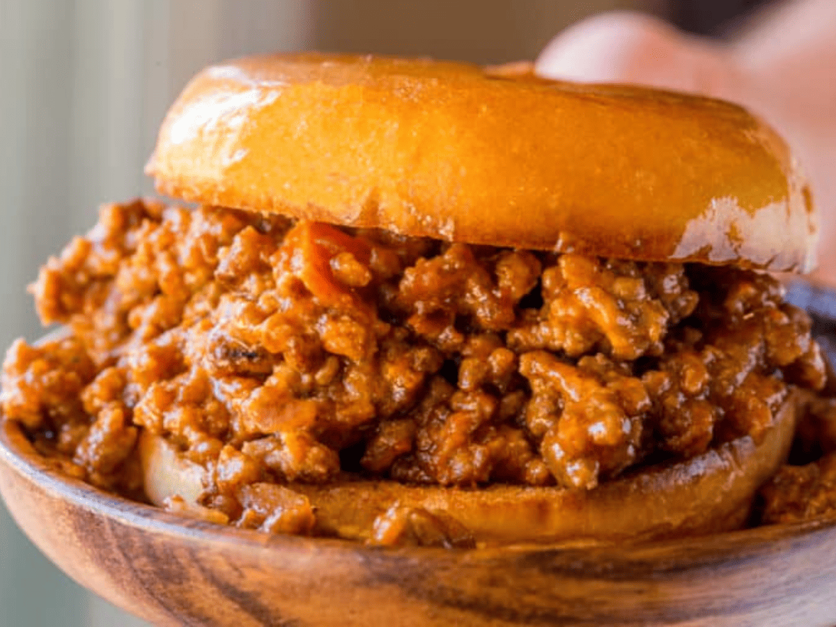 sloppy Joe sandwich on wood plate