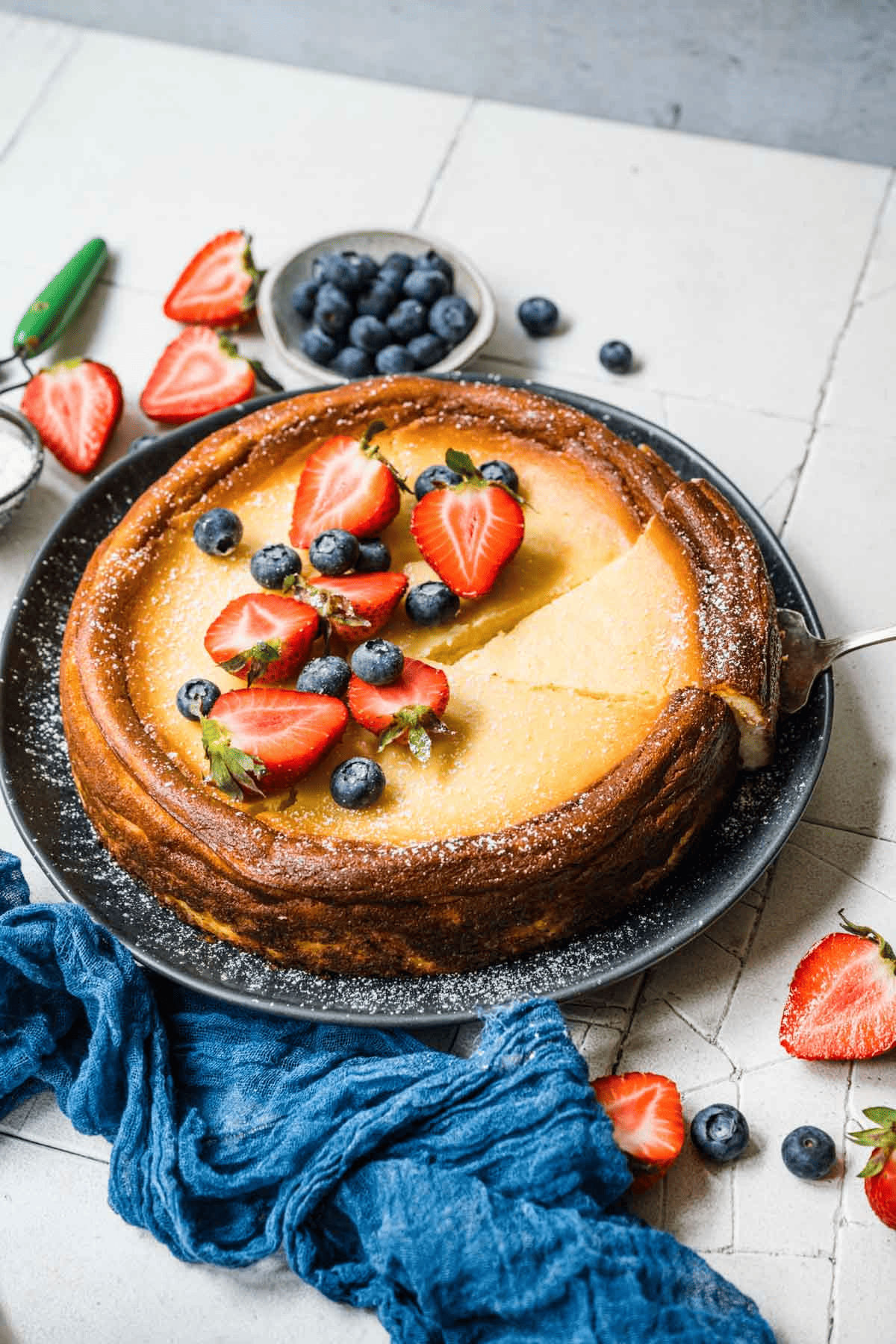 Taking one slice from whole cheesecake