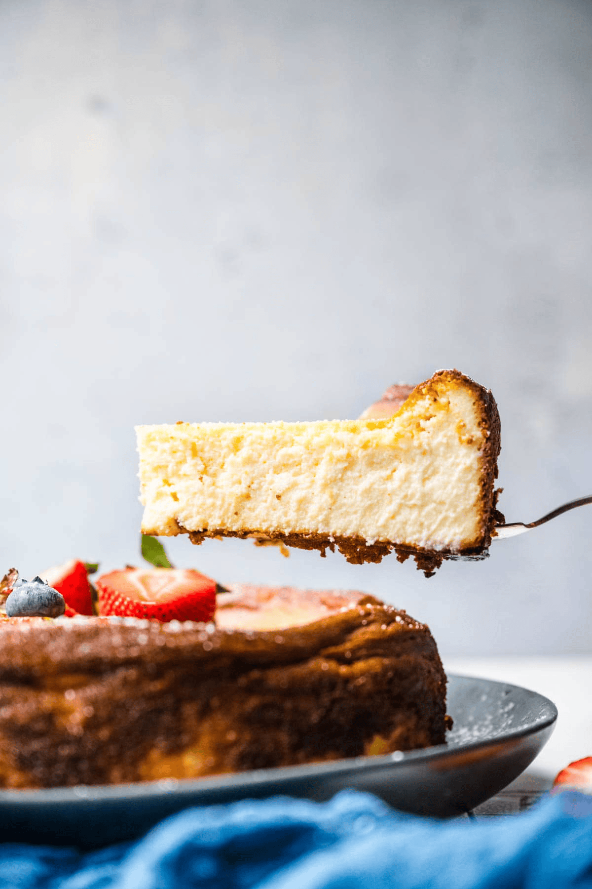 cheesecake slice being served