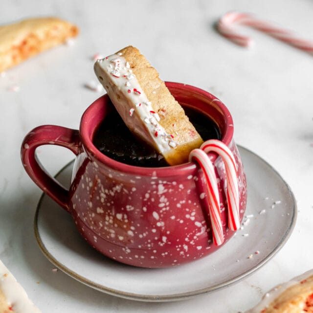 Peppermint Dipped Biscotti being dipped into coffee